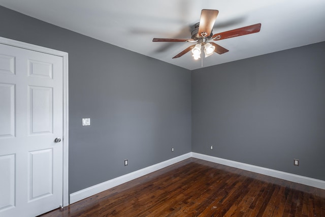 unfurnished room with dark hardwood / wood-style flooring and ceiling fan