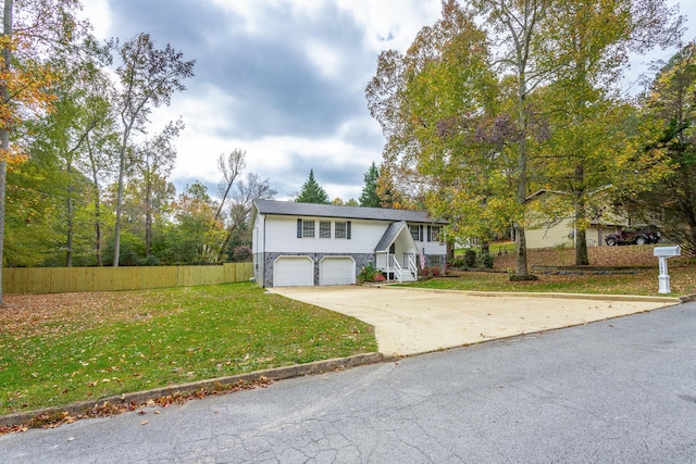 view of front facade with a front lawn and a garage