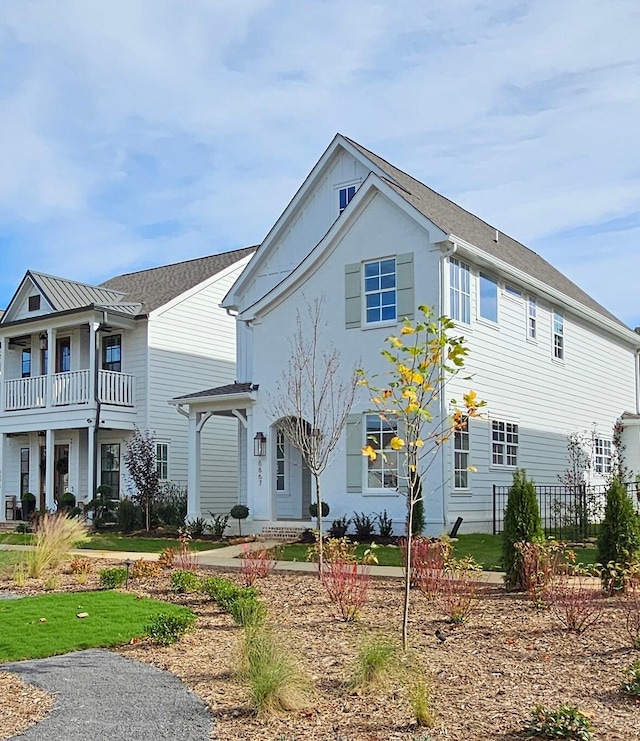 view of front of house with a balcony