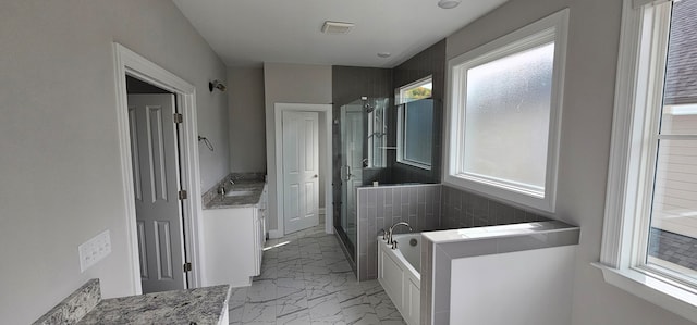 bathroom with plus walk in shower and vanity