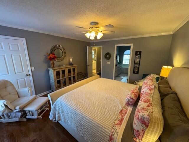 bedroom with ensuite bathroom, ceiling fan, dark hardwood / wood-style floors, and ornamental molding