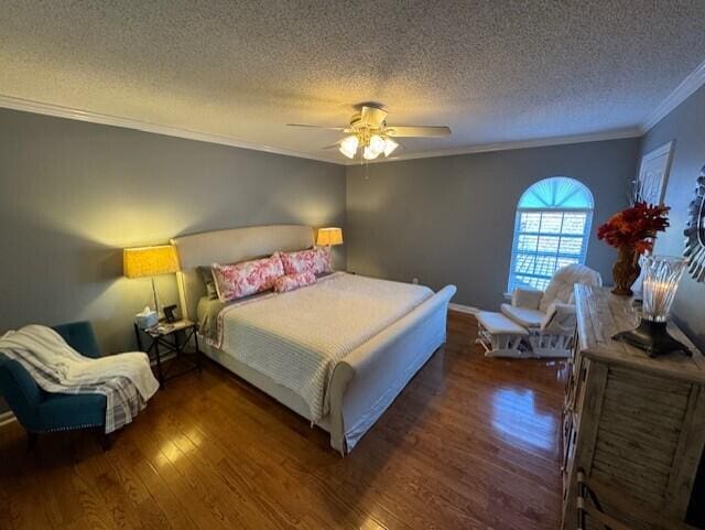 bedroom with a textured ceiling, dark hardwood / wood-style flooring, ceiling fan, and crown molding