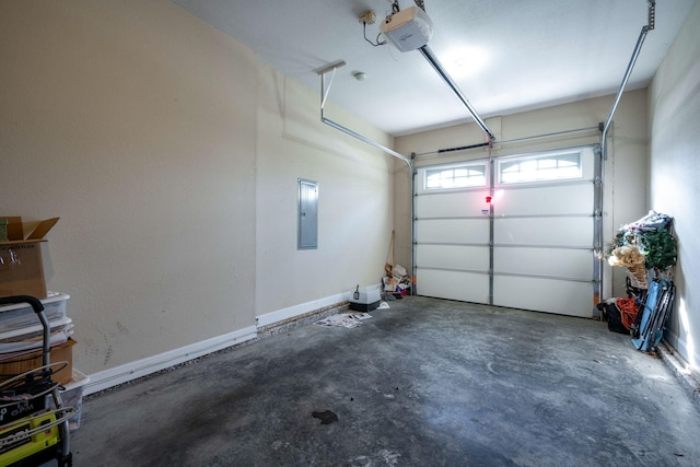 garage with a garage door opener and electric panel