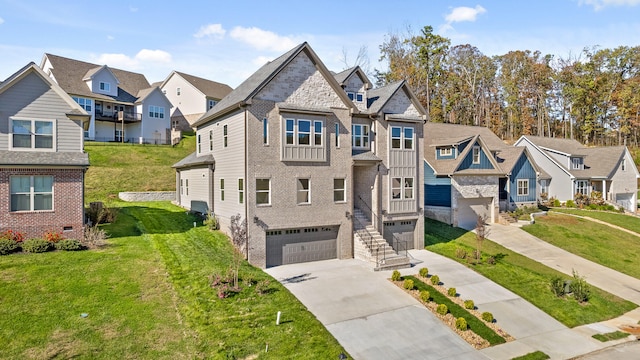 multi unit property featuring a garage and a front lawn