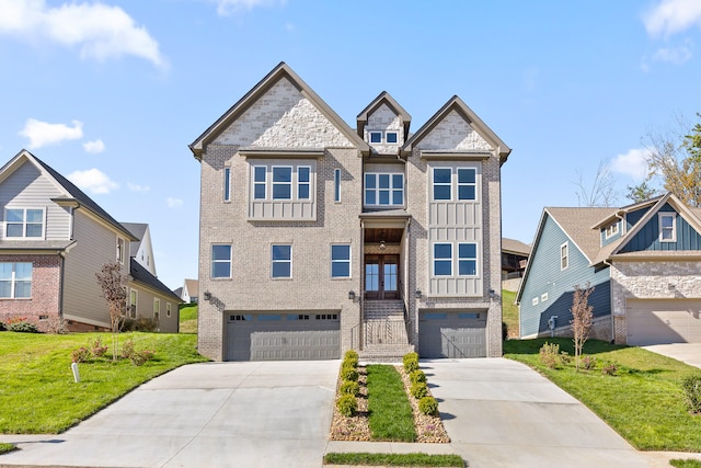 view of front facade featuring a front yard, french doors, and a garage