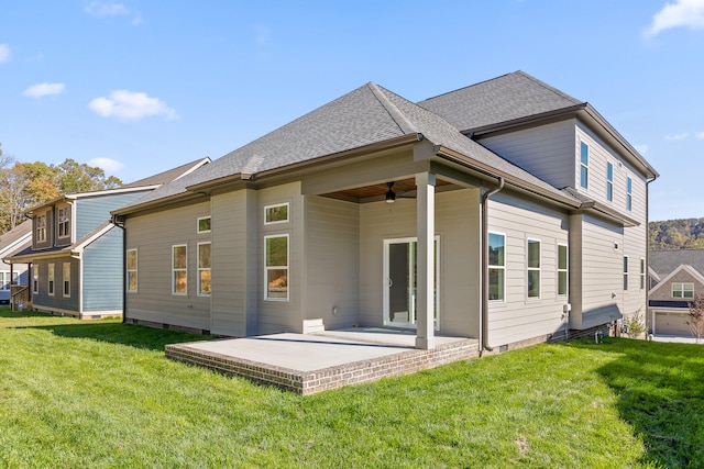 back of house featuring a yard, ceiling fan, and a patio area