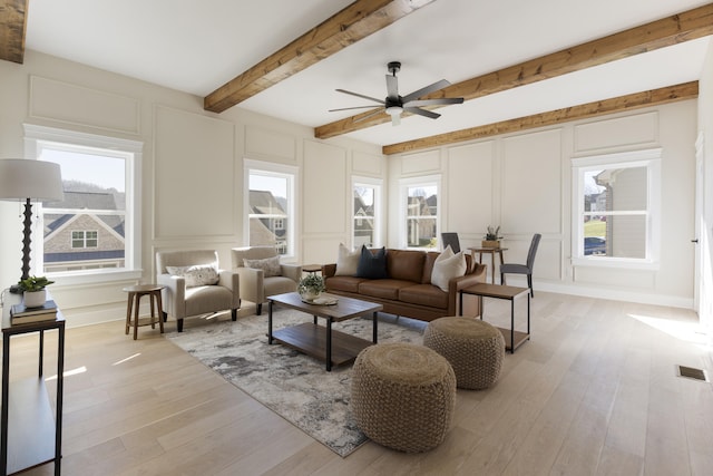 living room with ceiling fan and light hardwood / wood-style floors