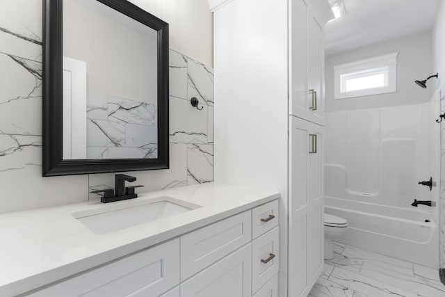 full bathroom with vanity, toilet, and shower / washtub combination