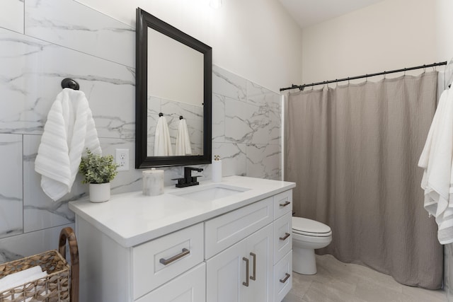 bathroom featuring a shower with curtain, vanity, tile walls, and toilet