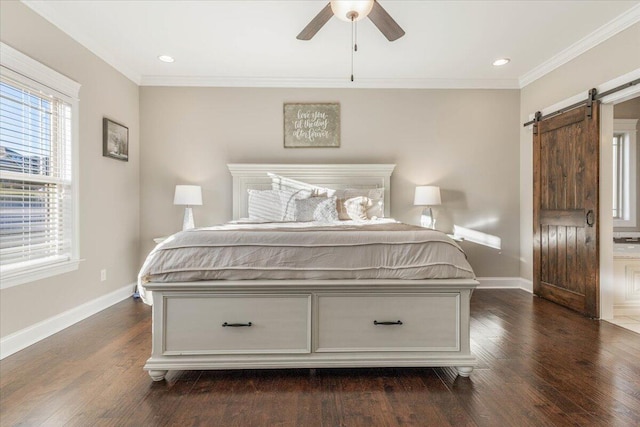 bedroom featuring a barn door, ceiling fan, crown molding, and dark wood-type flooring