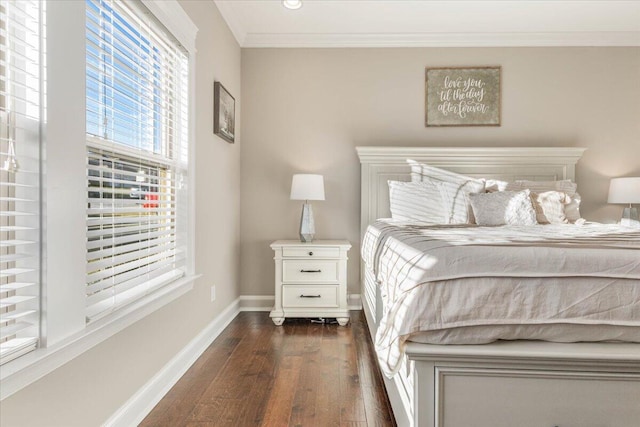 bedroom featuring crown molding and dark wood-type flooring