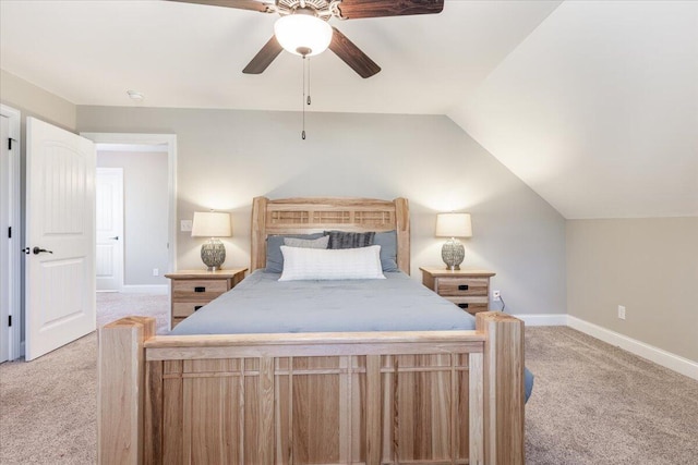 bedroom featuring ceiling fan, light colored carpet, and vaulted ceiling