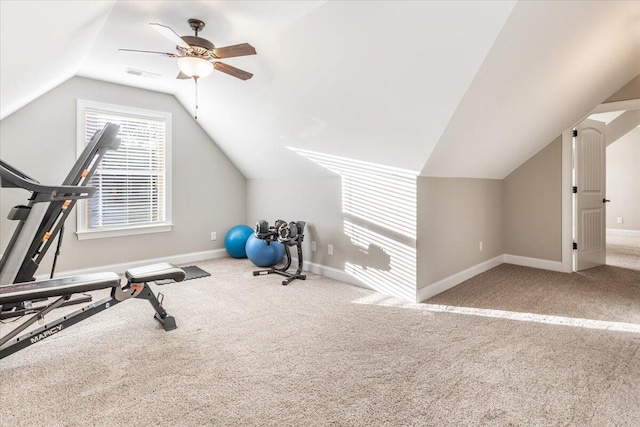 exercise room with lofted ceiling, ceiling fan, and carpet floors