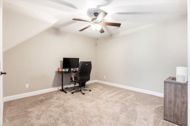 office area featuring light carpet, ceiling fan, and lofted ceiling