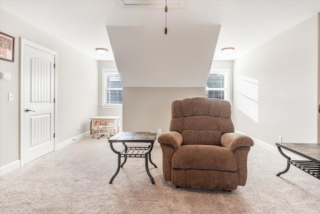 living area with light carpet