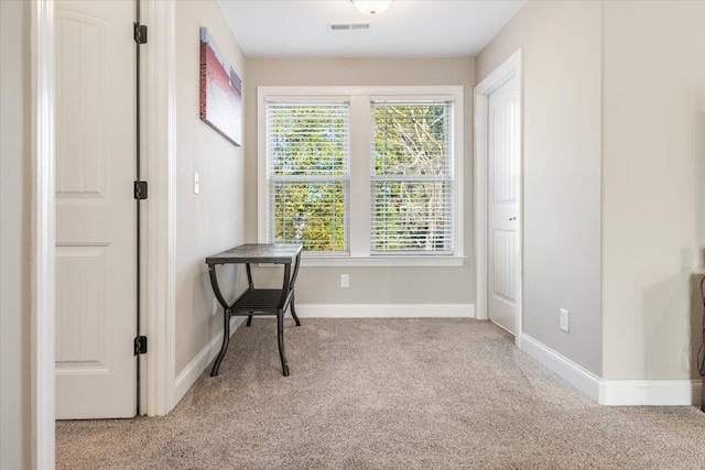 living area with light carpet