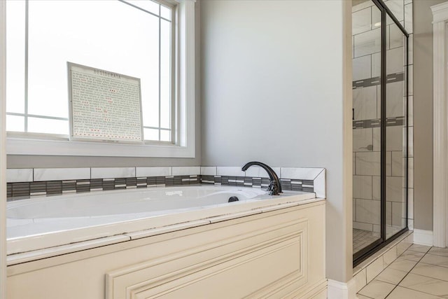 bathroom with shower with separate bathtub