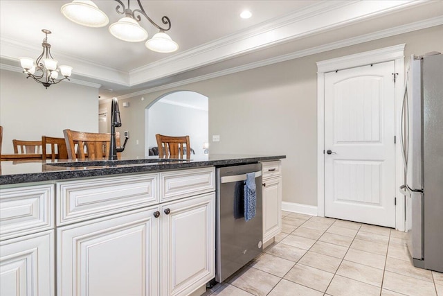 kitchen featuring white cabinetry, crown molding, and appliances with stainless steel finishes