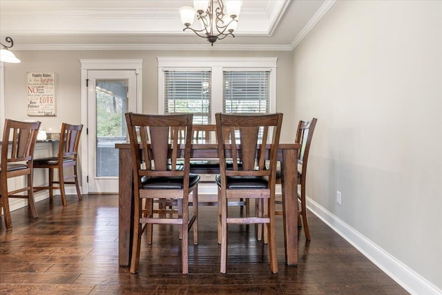 dining room featuring a chandelier, crown molding, and dark wood-type flooring