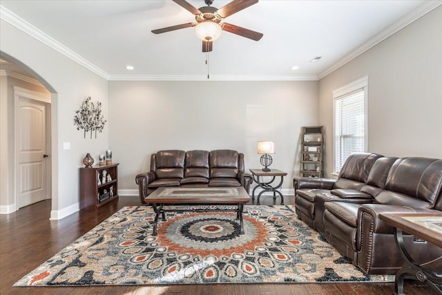 living room with ceiling fan, dark hardwood / wood-style flooring, and crown molding