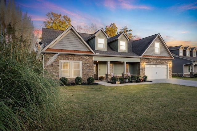 view of front of property featuring a lawn and a garage