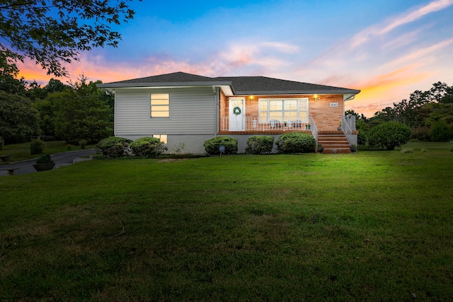 view of front of house with a lawn