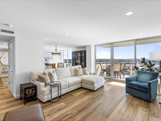 living room featuring light hardwood / wood-style flooring and expansive windows