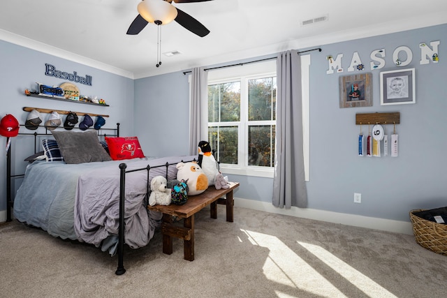 bedroom with ceiling fan, carpet, and ornamental molding