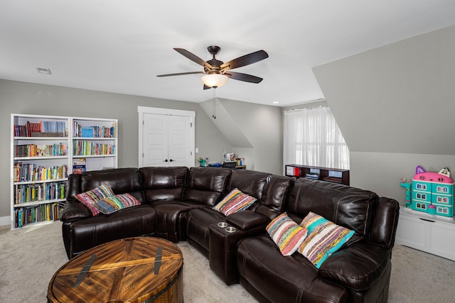 living room with light carpet, vaulted ceiling, and ceiling fan