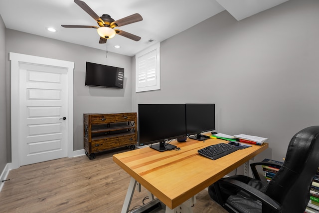 office space featuring ceiling fan and light hardwood / wood-style flooring