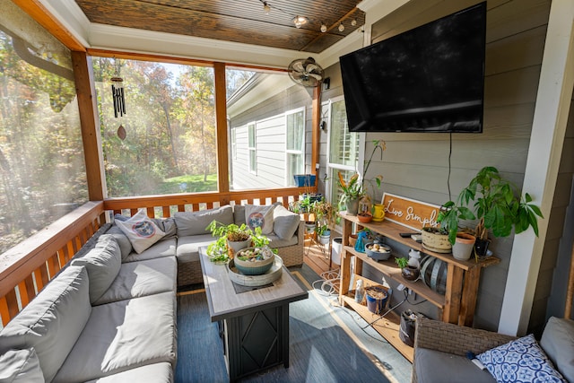 sunroom / solarium featuring wooden ceiling