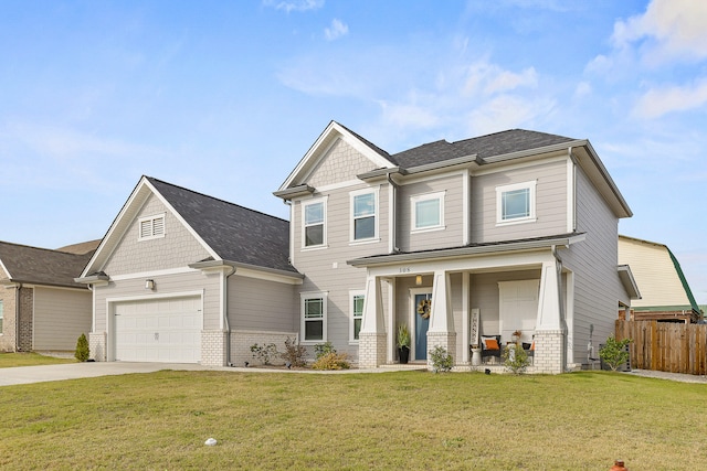 craftsman inspired home featuring a garage, covered porch, and a front yard