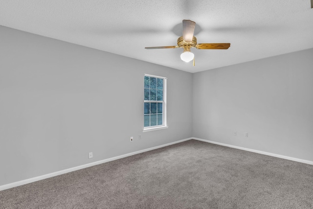 unfurnished room featuring carpet flooring, ceiling fan, and a textured ceiling