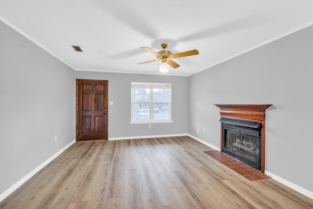 unfurnished living room with crown molding, light hardwood / wood-style flooring, and ceiling fan