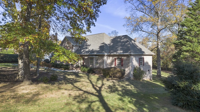 145 County Road 573, Englewood, TN 37329 - view of home's exterior with a lawn and brick siding