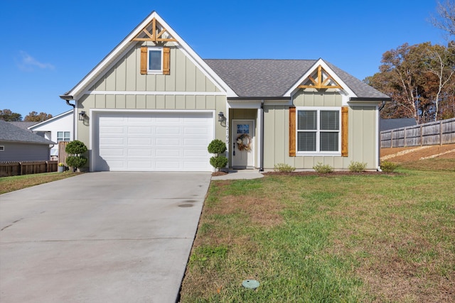 view of front of home featuring a front yard and a garage