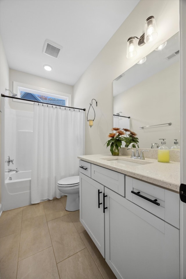 full bathroom with tile patterned flooring, shower / bath combination with curtain, vanity, and toilet