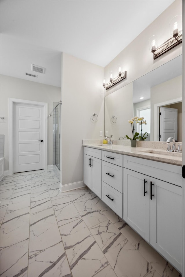 bathroom with vanity and walk in shower