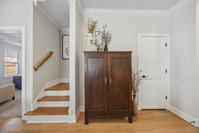 interior space with wood-type flooring and ornamental molding