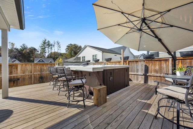 wooden deck with exterior bar