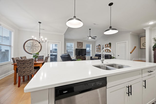 kitchen featuring white cabinetry, sink, light hardwood / wood-style flooring, stainless steel dishwasher, and a center island with sink