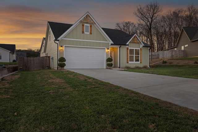 view of front facade with a lawn and a garage