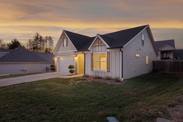 view of front of house with a yard and a garage