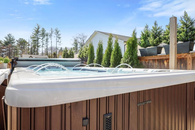 view of swimming pool with fence