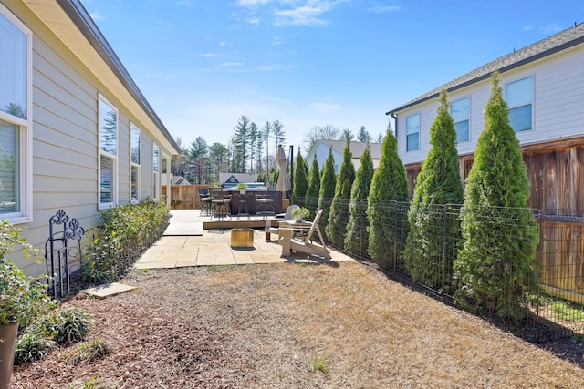 view of yard featuring a fenced backyard and a patio area