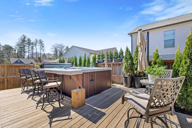 wooden deck with outdoor dining space and fence