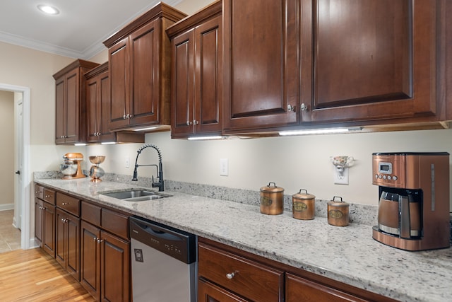 kitchen featuring light stone countertops, ornamental molding, sink, light hardwood / wood-style flooring, and dishwasher