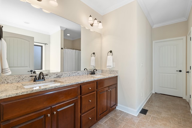 bathroom with crown molding and vanity