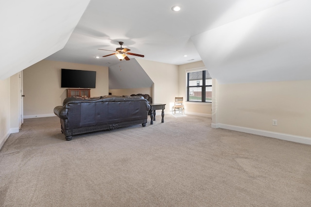 bedroom with light colored carpet, vaulted ceiling, and ceiling fan