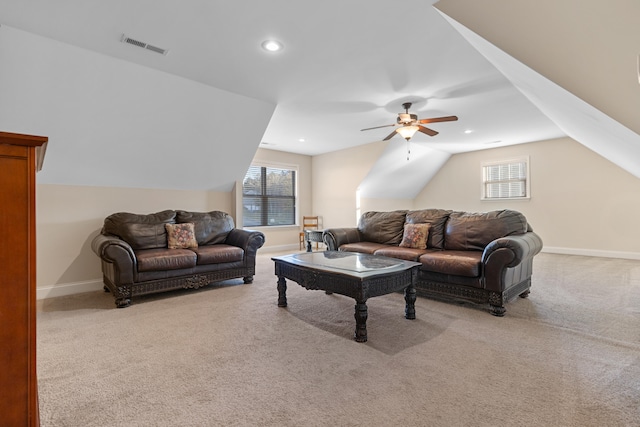 carpeted living room featuring ceiling fan and lofted ceiling